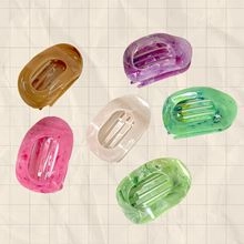 Set of six mini oval hair claws with marble texture in assorted pastel colors