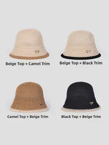 Detailed grid view of four two-tone crochet bucket hats featuring gold bow accents