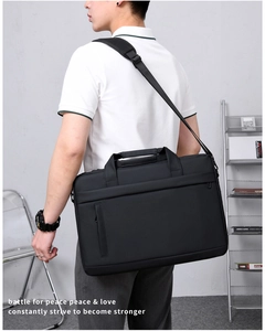 Business laptop bag with waterproof fabric featuring reinforced handles and shoulder strap