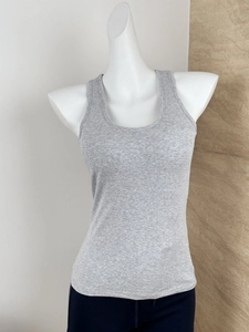 Detailed view of gray ribbed knit athletic tank top with wide straps and padded bust