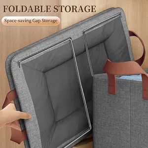 Foldable grey fabric storage bin with leather handles and space-saving steel frame design