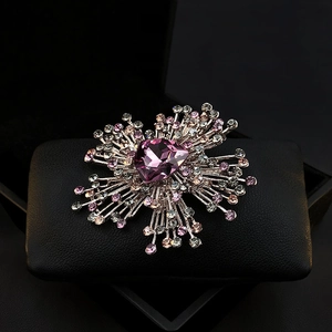 Luxurious silver brooch with heart-shaped purple crystal and rhinestone accents