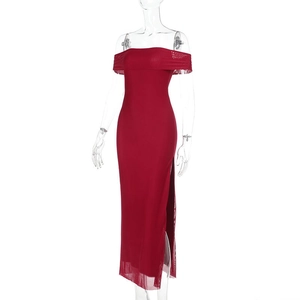 Detail view of the elegant off-shoulder neckline and side slit on the red bodycon dress