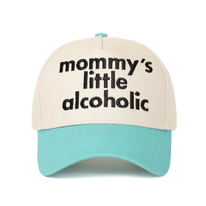 Detail of custom embroidery on a two-tone baseball cap with mint green and beige fabric