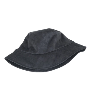 Flat lay of a black suede bucket hat on white background showing thick texture and fabric