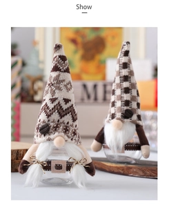 Detail view of Christmas gnome candy jars with knitted hats and clear glass bases