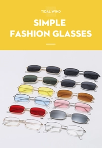 Flat lay of small rectangular metal sunglasses in various trendy colors and tinted lenses