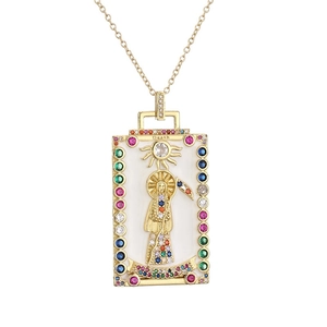 Detailed view of sun and death skeleton tarot pendant with colorful gems and gold frame