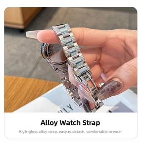Detail view of silver alloy watch strap with three-link chain and folding safety buckle