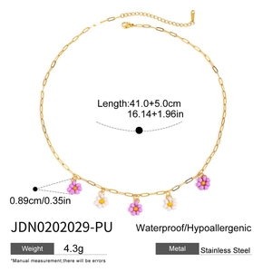 Macro view of stainless steel flower necklace with size dimensions and product details