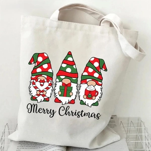 Detail showing Christmas gnomes print and Merry Christmas text on white canvas tote bag