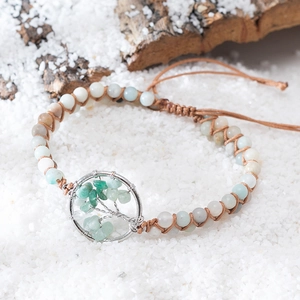 Handmade woven Tree of Life bracelet with natural crushed stones on wooden bark