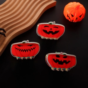 Halloween pumpkin ghost hair claws with laser effect on black festive background