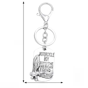 Macro shot of vintage eagle shield pendant keychain with American legend engraving