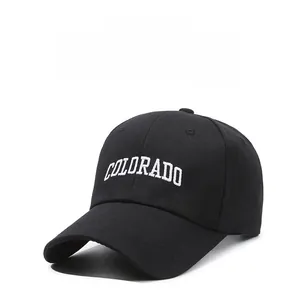 Close-up of white Colorado letter embroidery on black cotton baseball cap with six panels