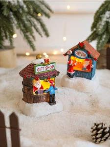 Glow-in-the-dark Christmas resin miniature gift shop and candy store on snow base