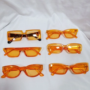 Trendy orange transparent plastic sunglasses in round, square, and cat eye retro styles