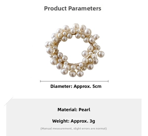 Detail of beaded elastic hair tie featuring multiple white pearls with 5cm diameter