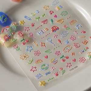 3D embossed nail stickers featuring colorful cartoon stars, hearts and floral patterns