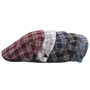 Set of five retro plaid beret caps in various colors for men and women displayed on white