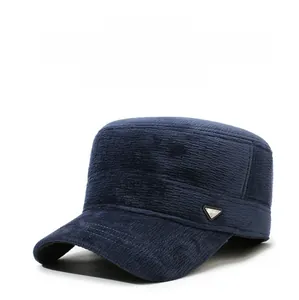 Detail of navy blue corduroy winter cap with ear flaps and thick warm fabric lining