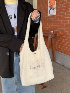 White plush fleece tote bag with Lucky embroidery and smiley face for winter fashion