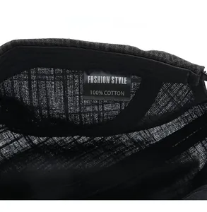 Macro view of 100% cotton inner fabric and care label of the plaid baseball cap