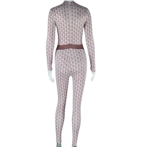 Rear view of patterned jumpsuit featuring geometric prints and a concealed back zipper