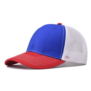 Detail of red, white, and blue mesh trucker hat with curved brim and breathable back