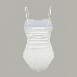 White one-piece swimsuit with broderie anglaise embroidery and adjustable straps