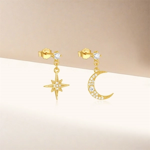 Detailed view of asymmetric gold S925 silver stud earrings with zircon star and moon