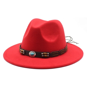 Detail of red wool fedora with bohemian leather band and turquoise stone accent