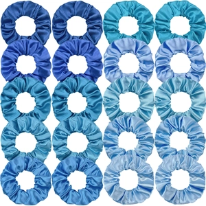 Flat lay of 20 blue gradient satin scrunchies in a neat grid on a white background