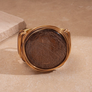 Artistic bronze woven wide resin bangle with geometric circular design and vintage metal wire