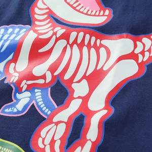 Boys navy blue cotton t-shirt featuring vibrant cartoon luminous dinosaur skeleton print