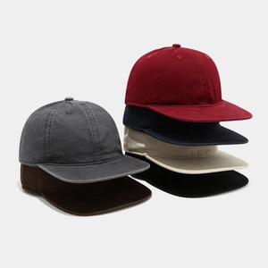 Detailed stack of multi-color vintage washed cotton caps in diverse retro shades