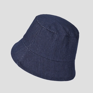 Close-up of deep blue denim fisherman hat showing high-quality woven fabric texture