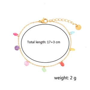 Gold stainless steel bracelet with colorful rainbow gems on a clean white background