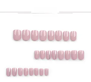 Detail of mauve pink press-on nails with silver glitter stripes in glossy finish