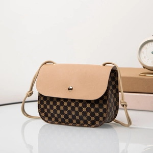 Detail of vintage drawstring crossbody bag with brown pattern and metal buckle