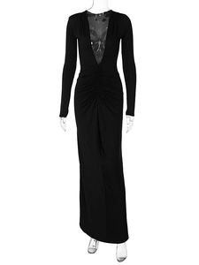 Detail view of deep V-neck and ruched waist on a black long sleeve bodycon maxi dress