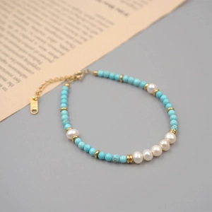 Baroque pearl and turquoise beaded bracelet with gold accents and adjustable chain