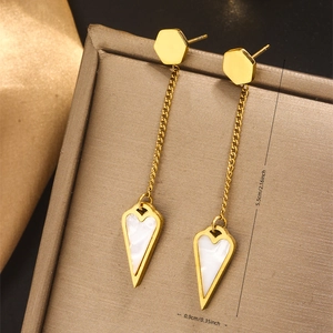 Detailed view of 18K gold plated tassel earrings with shell heart showing 5.5cm length