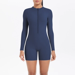 Front detail of navy blue long sleeve yoga bodysuit with half-zip and high-elastic fabric