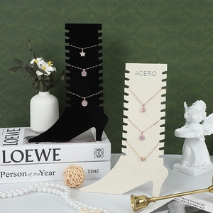 Elegant high heel shaped necklace display stands in black and beige velvet finish