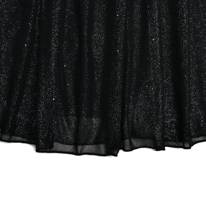 Close-up of black mesh skirt hem with sparkling sequin glitter details and fine texture