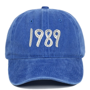 Detail of vintage washed cotton baseball cap with 1989 white 3D embroidery on front