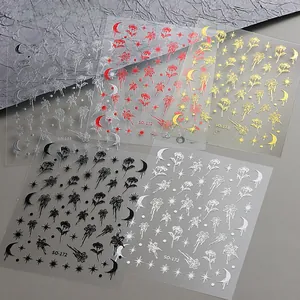 Detail of gothic nail art stickers featuring gold lily and heart liquid drip patterns