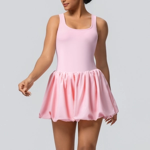 Pink sleeveless tennis dress with a voluminous balloon skirt and backless design