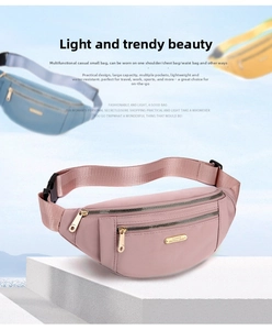 Detailed close-up of pink nylon crossbody bag with multi-layer zippers and buckle strap